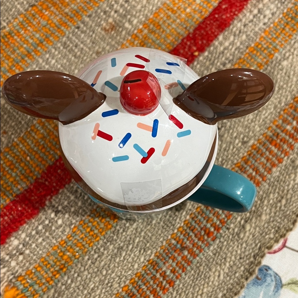 Disney mug with ear lid and sprinkles 
Never used.